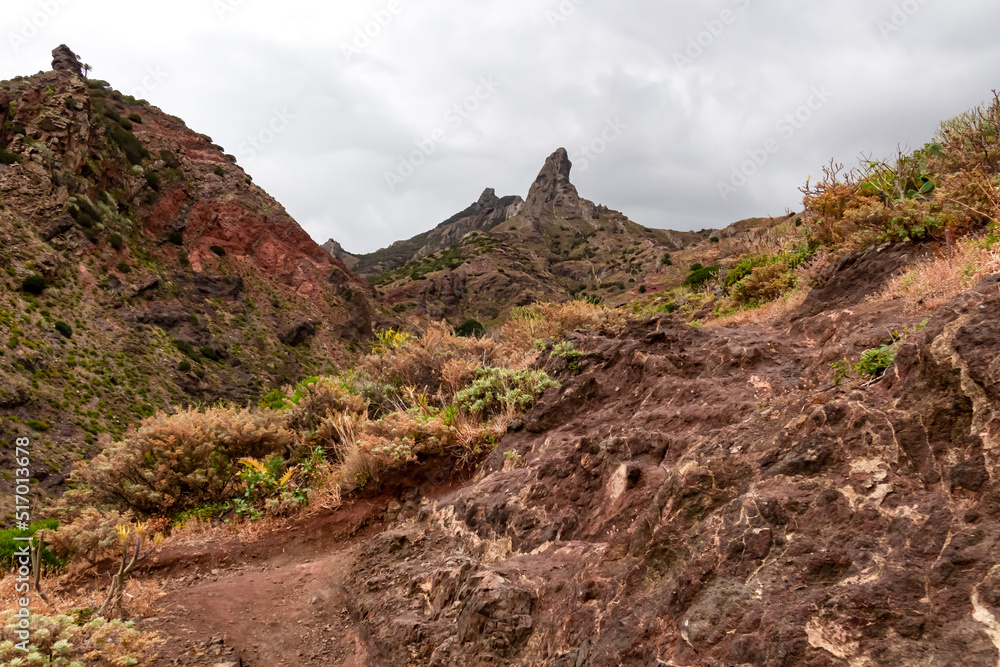 Panoramic view on El Dedo del Roque Pai crag, Roque Paez in the Anaga mountain range, Tenerife, Canary Islands, Spain, Europe. Scenic hiking trail from Afur to Taganana through canyon Barranco de Afur