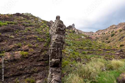 Panoramic view on El Dedo del Roque Pai crag, Roque Paez in the Anaga mountain range, Tenerife, Canary Islands, Spain, Europe. Scenic hiking trail from Afur to Taganana through canyon Barranco de Afur photo