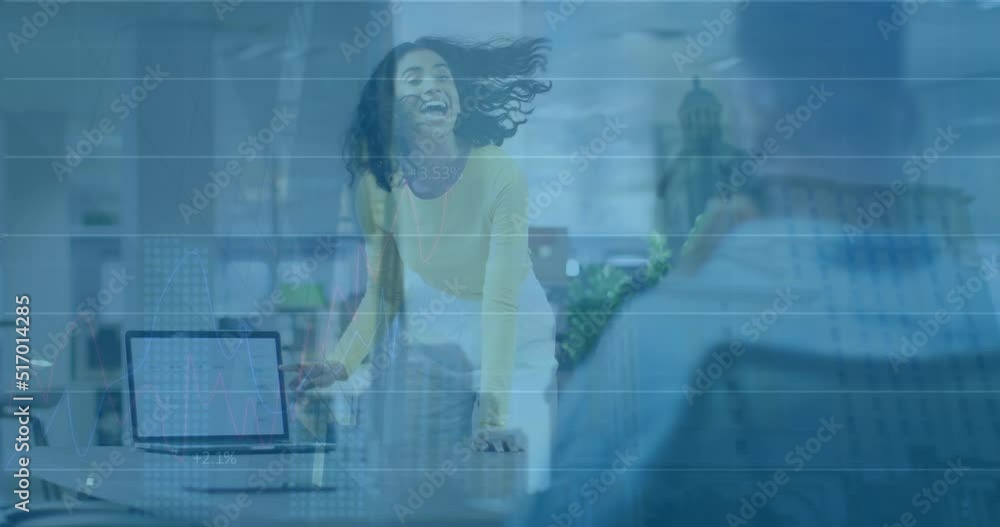 Animation of graphs over biracial woman with laptop in office Animation of graphs over biracial woman with laptop in office