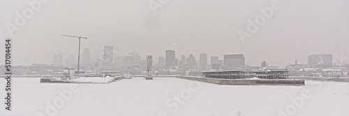 Skyscrapers in Montreal on a hazy winter day, view from across Saint Lawrence river. Quebec, Canada photo