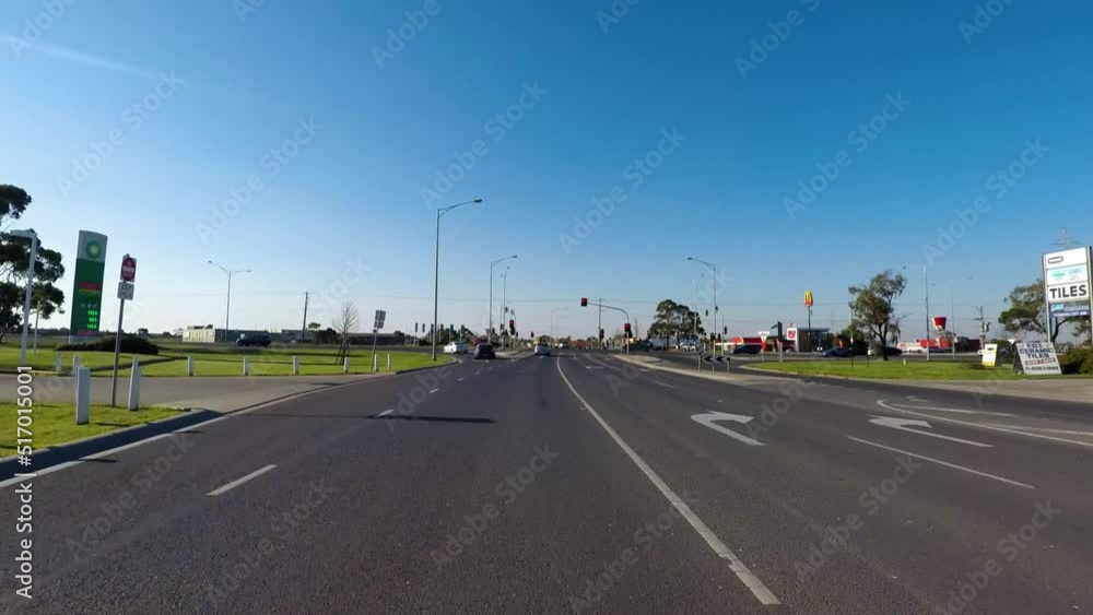 A video has been taken from a running car which capturing the road view along with cars running along the road A video has been taken from a running car which capturing the road view along with cars running along the road
