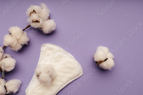 Women menstrual cycle concept. Sanitary pad isolated on purple background