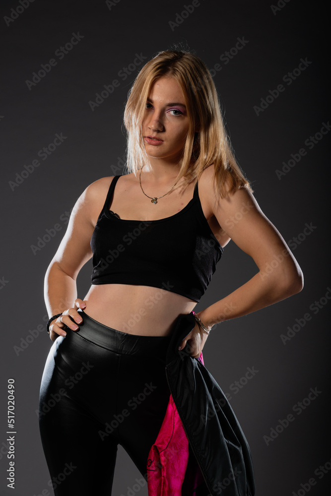 Sexy blonde in leather black pants going crazy. Sexy blonde in leather black pants going crazy.