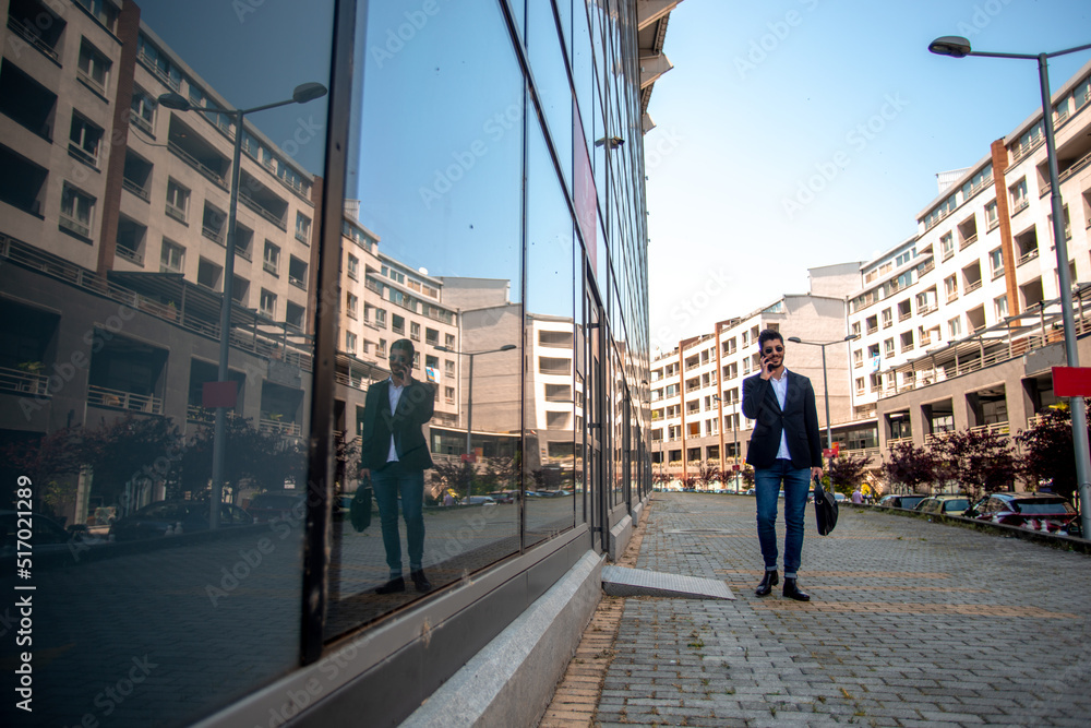 Talking on the phone near the building