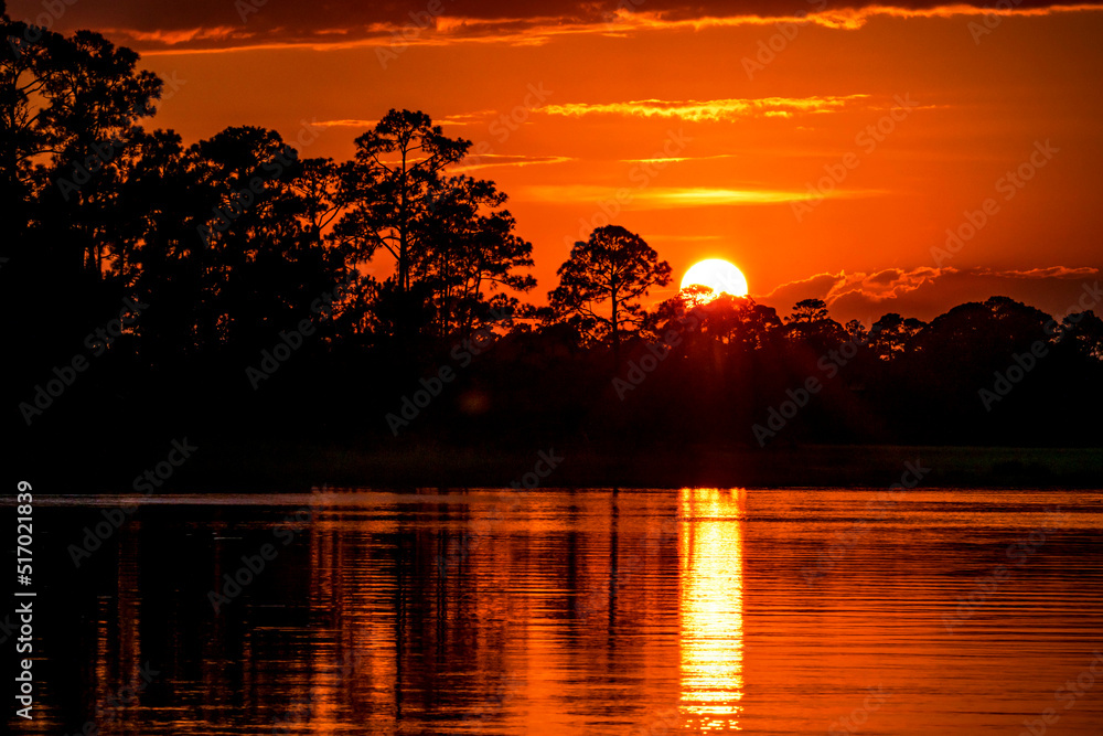 Fototapeta premium Sunset reflected in marshes near Charleston, SC.