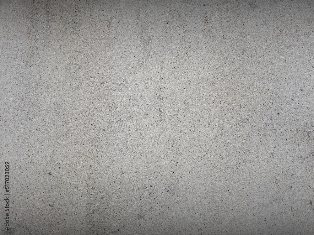 Fototapeta premium Cracked white wall cement texture for background. Close up image of raw grunge surface material.