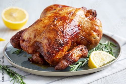Canvas Print Homemade Lemon and Herb Rotisserie Chicken on a Plate, side view