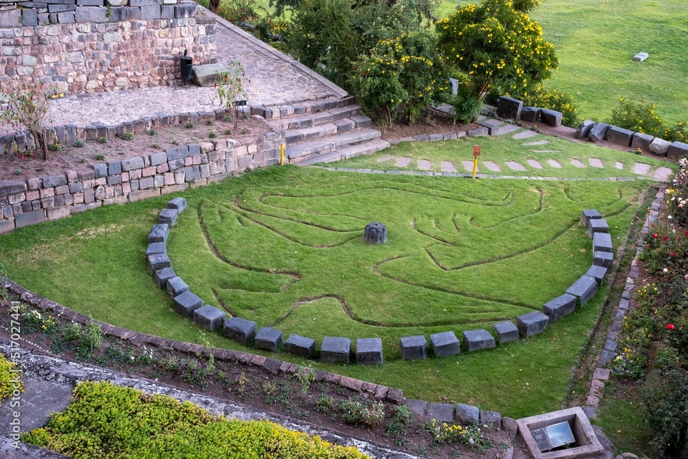 Inca ruin with a condor logo in the middle Inca ruin with a condor logo in the middle