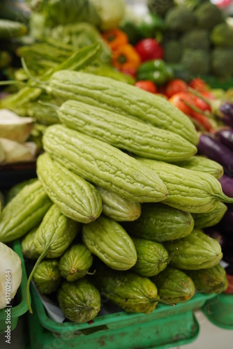 Valokuvatapetti Batch of green fruits of bitter melon. Tumpukan Pare