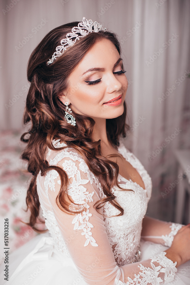 Young beautiful bride with brunette wedding hairstyle and makeup