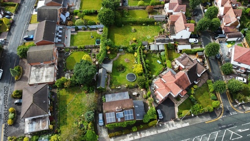 Photo Aerial top view of suburbs with beautiful houses and green lawns