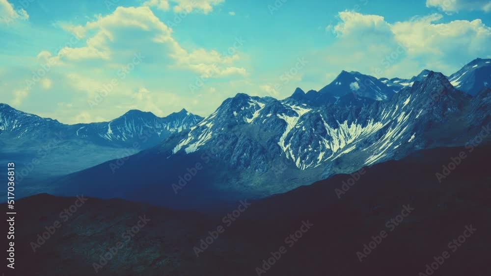 Aerial Over Valley With Snow Capped Mountains In Distance Aerial Over Valley With Snow Capped Mountains In Distance