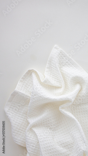 white kitchen towel with texture on a light background