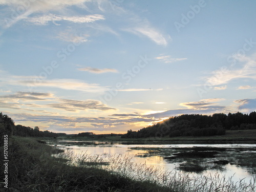 summer river in the countryside in the evening