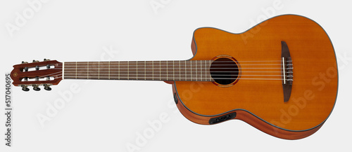 Classical guitar isolated on white background close up. Acoustic six-string wooden guitar. Musical instrument. Rock or jazz equipment.