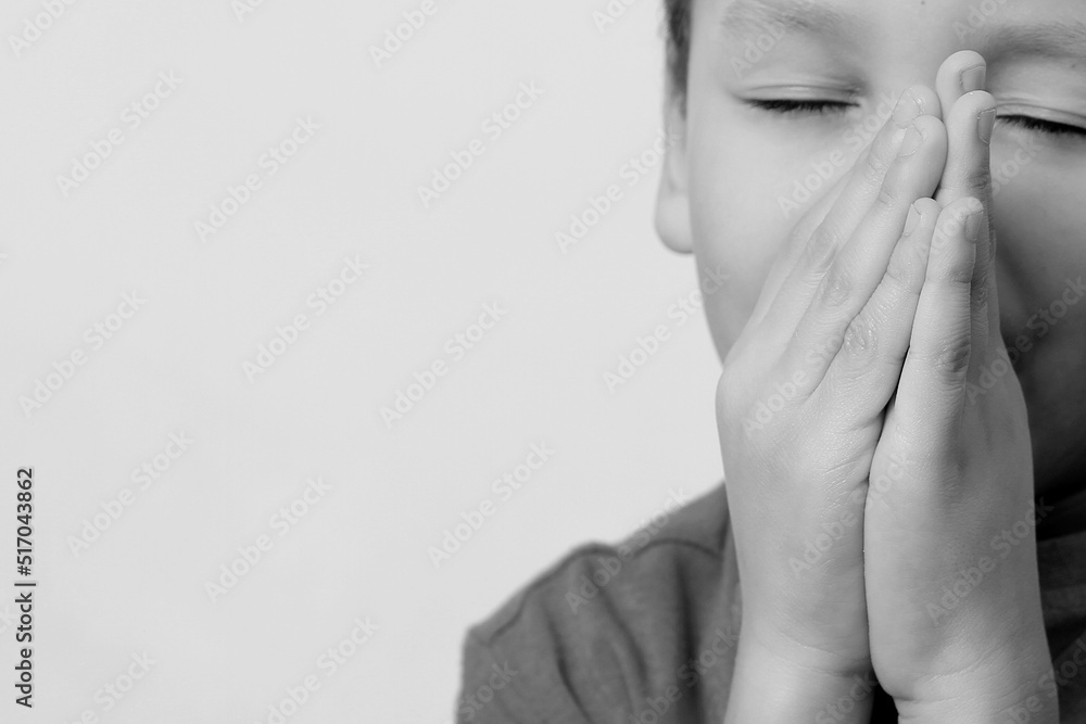 little boy praying to God with hands together stock image stock photo 