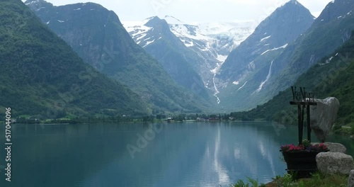 Wonderful landscapes in Norway. Sogn og Fjordane. Beautiful scenery of Briksdal glacier from the Yrineset viewpoint. Mountain, trees, rocks and fjord in background 4K UHD 59,94fps ProRes 422 HQ 10 bit