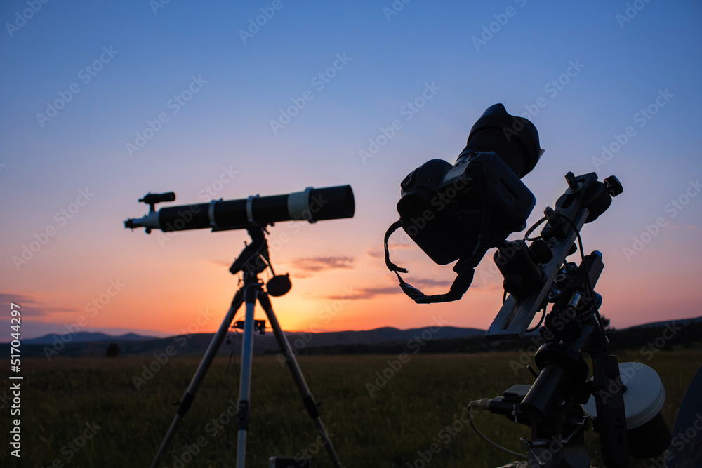 Astronomical telescope and camera equipment for capturing, observing stars, Milky way and planets in nature, far from light pollution and urban zones.