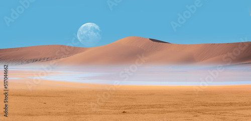 Panoramic view of desert plains in Namibia Africa with hills and mountains in the background - Full moon on the mountains