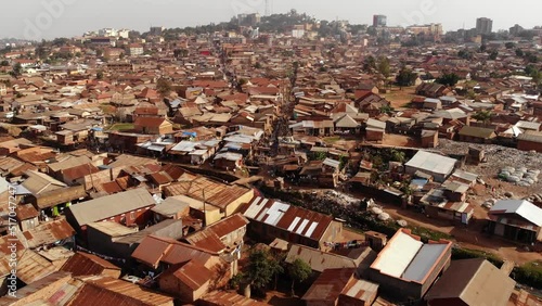 Drone shot over the slums of Uganda, poverty and poor one-storey buildings. Africa. photo