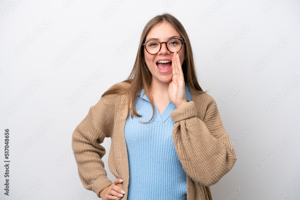Young Lithuanian woman isolated on white background shouting with mouth wide open