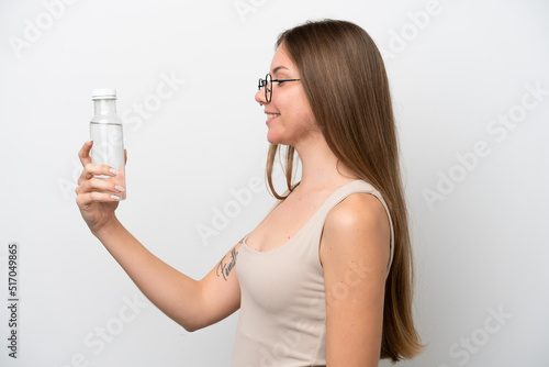 Young Lithuanian woman with a bottle of water isolated on white background with happy expression