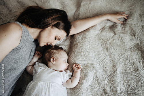 Baby sleeps with mather