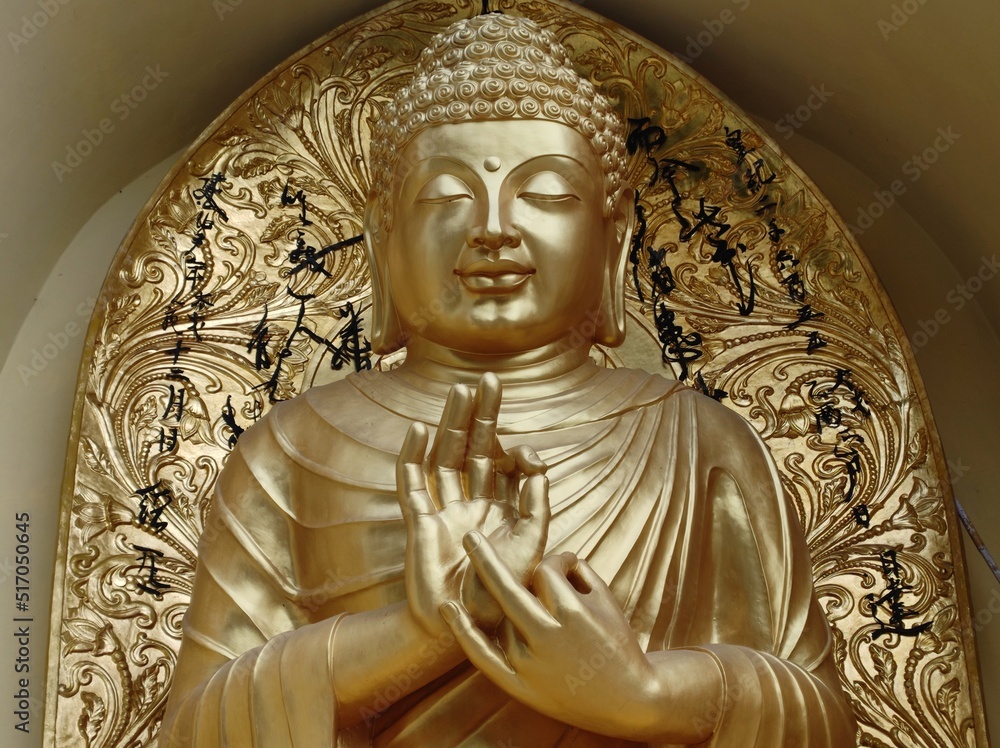 Golden idol of Japanese Lord Buddha sitting in meditative position