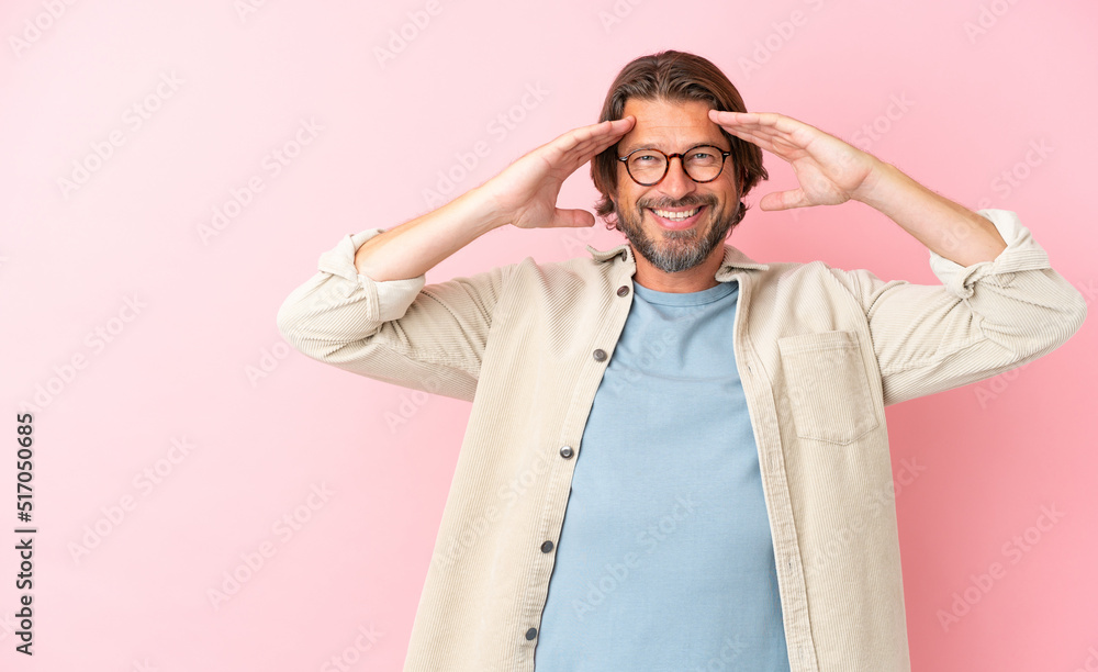 Senior dutch man isolated on pink background with surprise expression Senior dutch man isolated on pink background with surprise expression