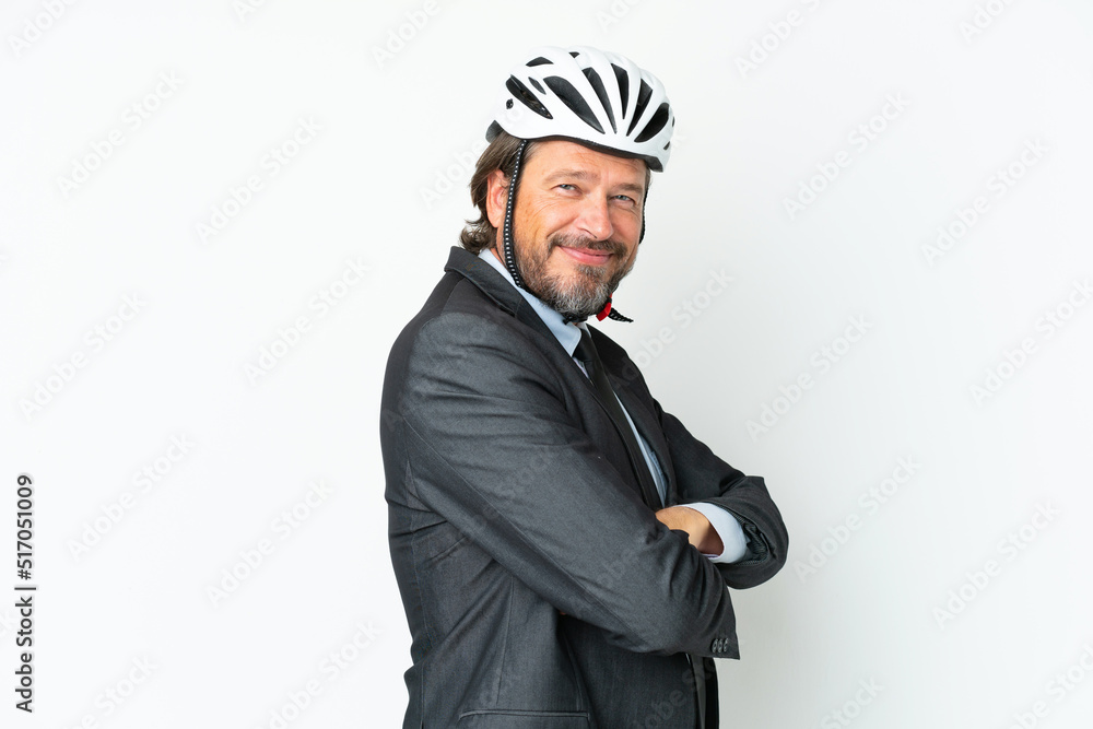 Business senior man with a bike helmet isolated on white background with arms crossed and looking forward Business senior man with a bike helmet isolated on white background with arms crossed and looking forward