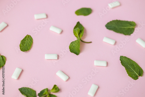 Chewing gum with mint on pink background