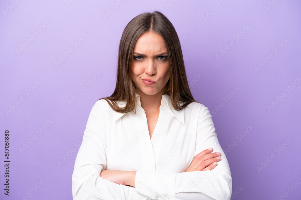 Young caucasian woman isolated on purple background with unhappy expression Young caucasian woman isolated on purple background with unhappy expression