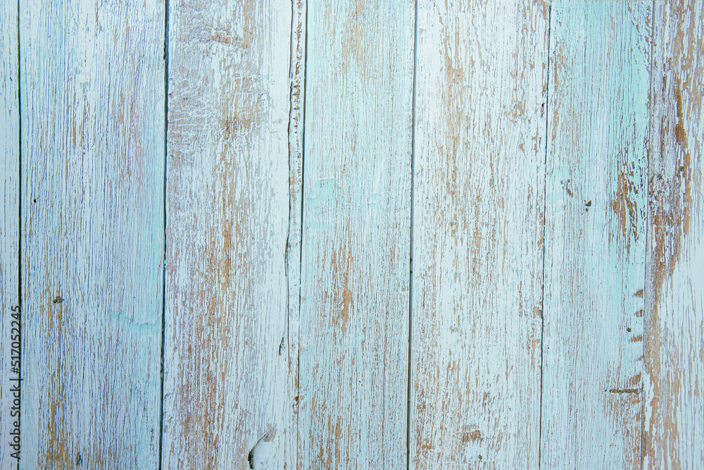 Light blue and brown painted wood background texture in foreground with space for text or design Light blue and brown painted wood background texture in foreground with space for text or design