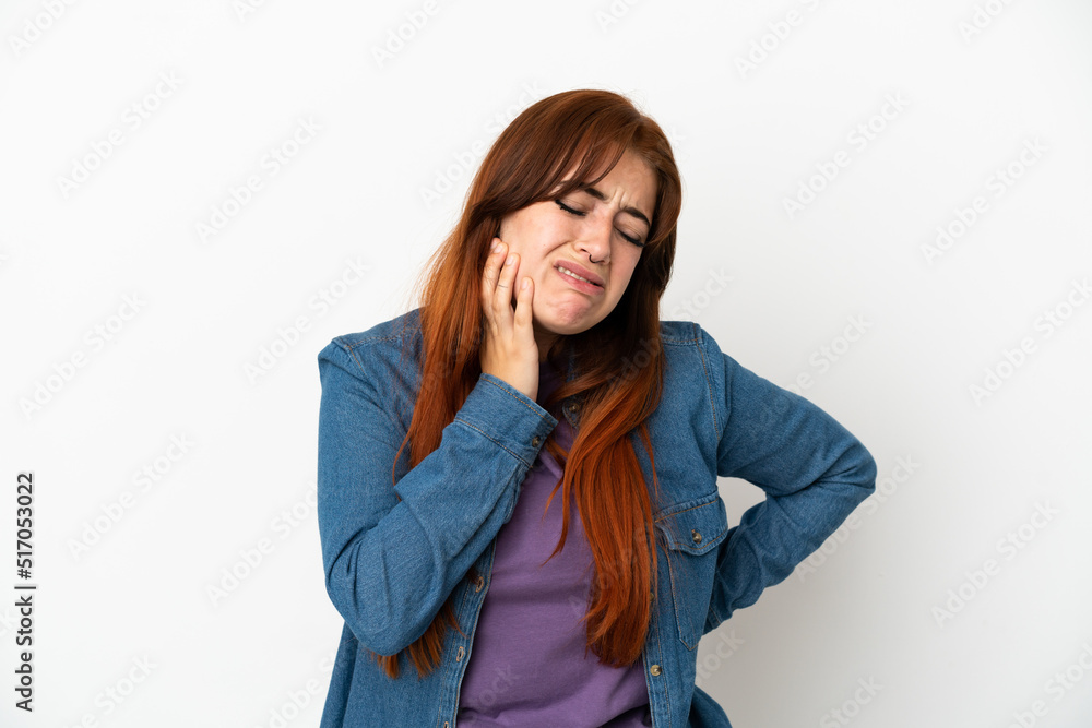 Young redhead woman isolated on white background with toothache Young redhead woman isolated on white background with toothache