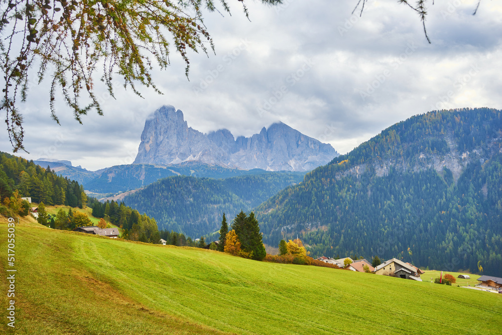 Gorgeous morning scene in Compaccio village and bright larchs. Location place Dolomiti alps, Seiser Alm or Alpe di Siusi, South Tyrol, Italy, Europe.