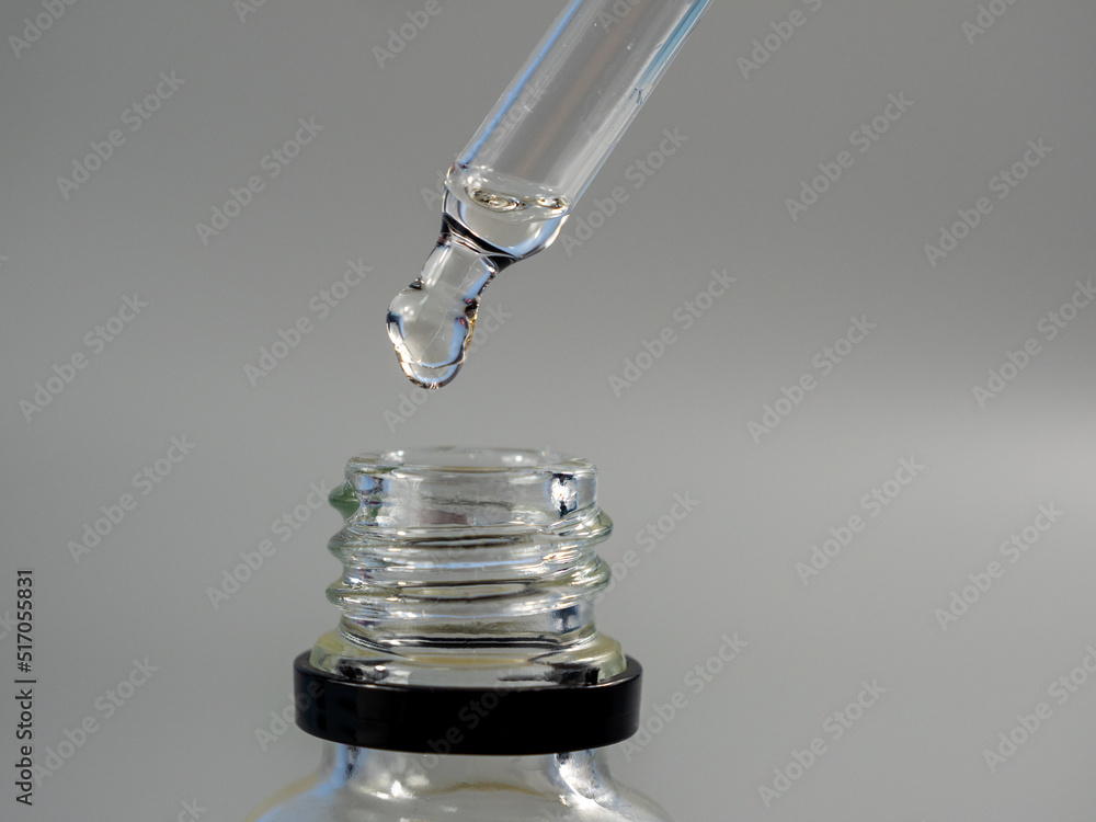 Oil for skin care is dripping with a pipette. Oil for skin care is dripping with a pipette.