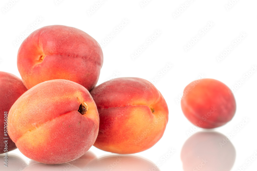Several ripe red apricots, close-up, isolated on a white background. Several ripe red apricots, close-up, isolated on a white background.