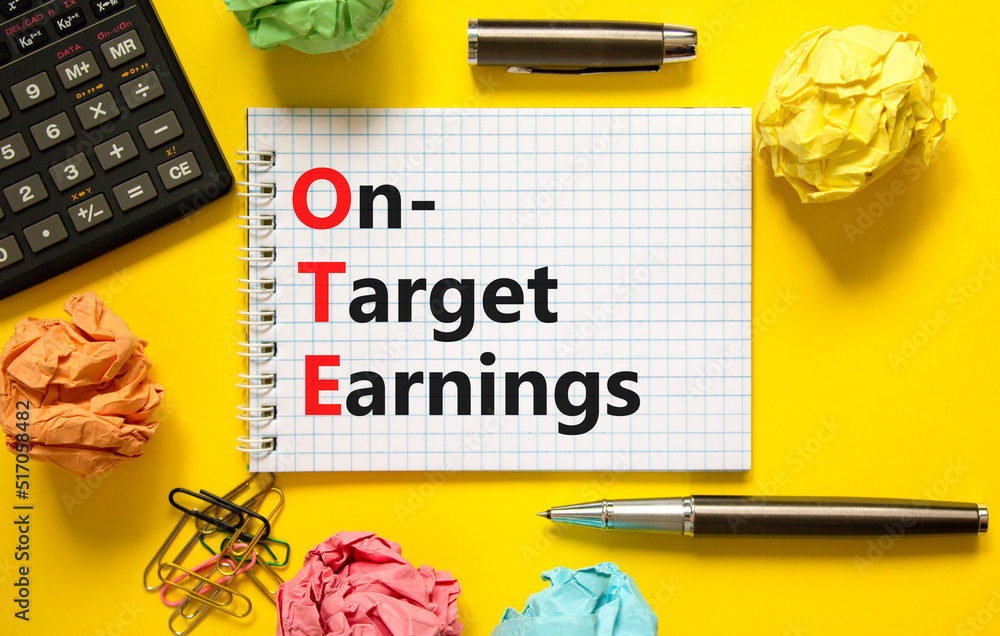 OTE on-target earnings symbol. Concept words OTE on-target earnings on white note on a beautiful yellow background. Calculator and pen. Business and OTE on-target earnings concept. Copy space. OTE on-target earnings symbol. Concept words OTE on-target earnings on white note on a beautiful yellow background. Calculator and pen. Business and OTE on-target earnings concept. Copy space.