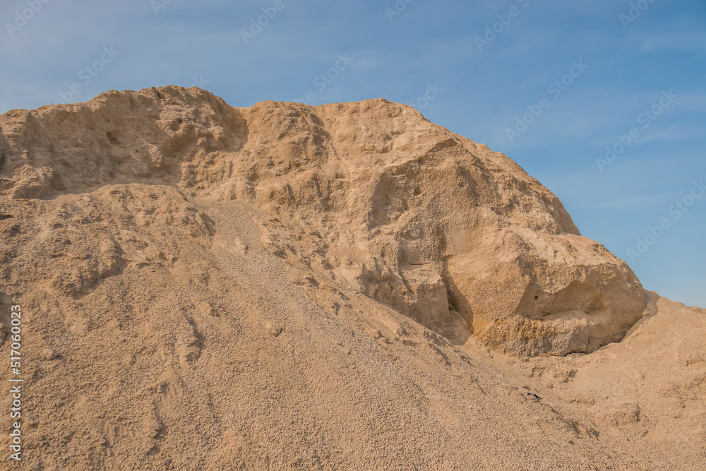 A stockpile of inert building materials. A large pile of sand and gravel. High resolution photo. A stockpile of inert building materials. A large pile of sand and gravel. High resolution photo.