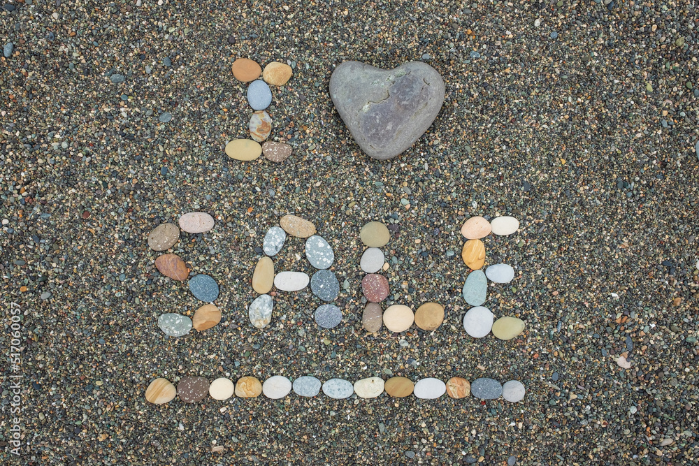 I love sale made from stones on sandy beach. I love sale made from stones on sandy beach.