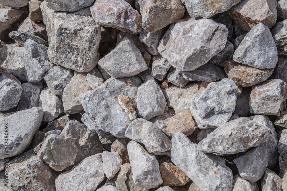 Stones cobblestones under the railway.Lime stone close-up as a background