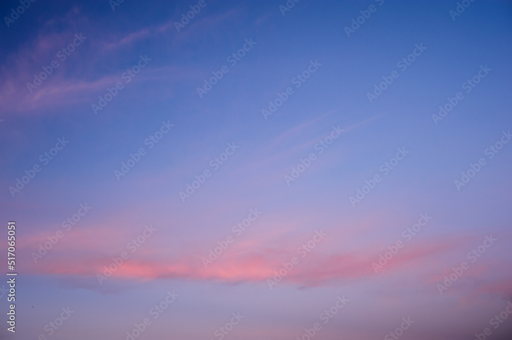 Scenic view of orange clouds on blue sunset sky