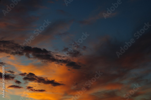 Scenic view of sunset sky with orange light in clouds 