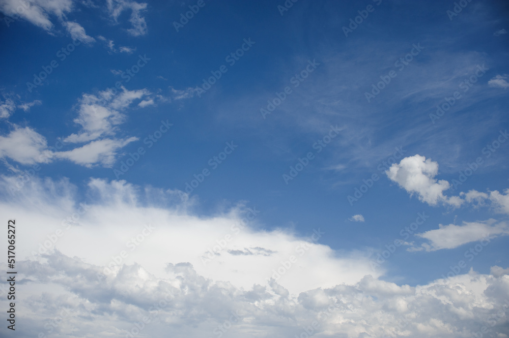 Obraz premium Scenic view of blue sky with white cumulus clouds, natural background