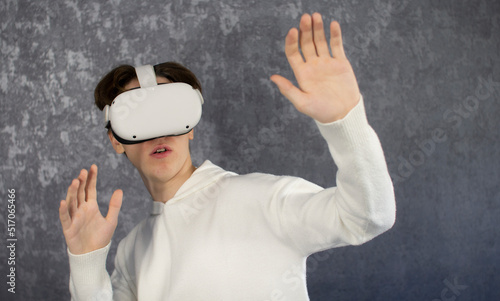 Amazed teenager using VR headset. Teen man play vr video game. Digital future and innovation. virtual goggles. Excited teen man with virtual reality goggles headset.