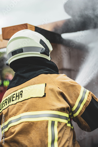 Firefighter fights flames, extinguish fire, big house fire catastrophy 