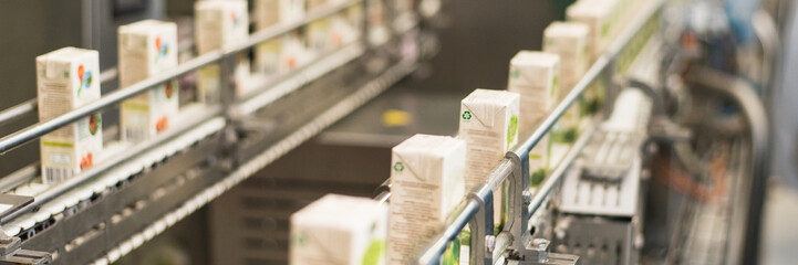 production of juices in cardboard packaging. Industry, Metal Works. Web banner.