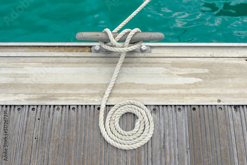 Photography Mooring rope with a knotted end tied around a cleat