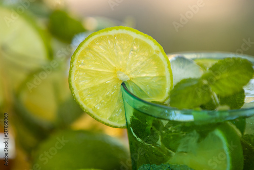 glass of mojito with lime, mint and brown sugar