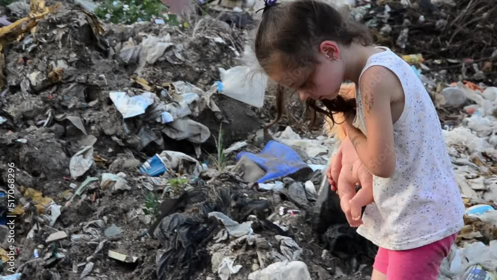 Children in the landfill. Child labour. A child in a city dump. The